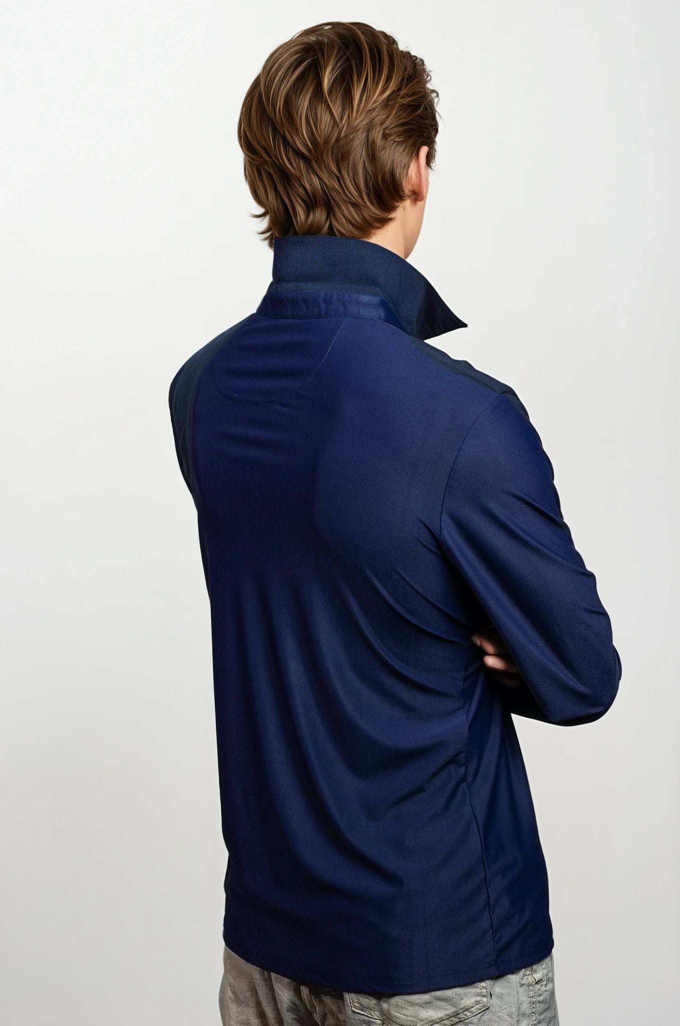 Man wearing a navy blue shirt on a white background