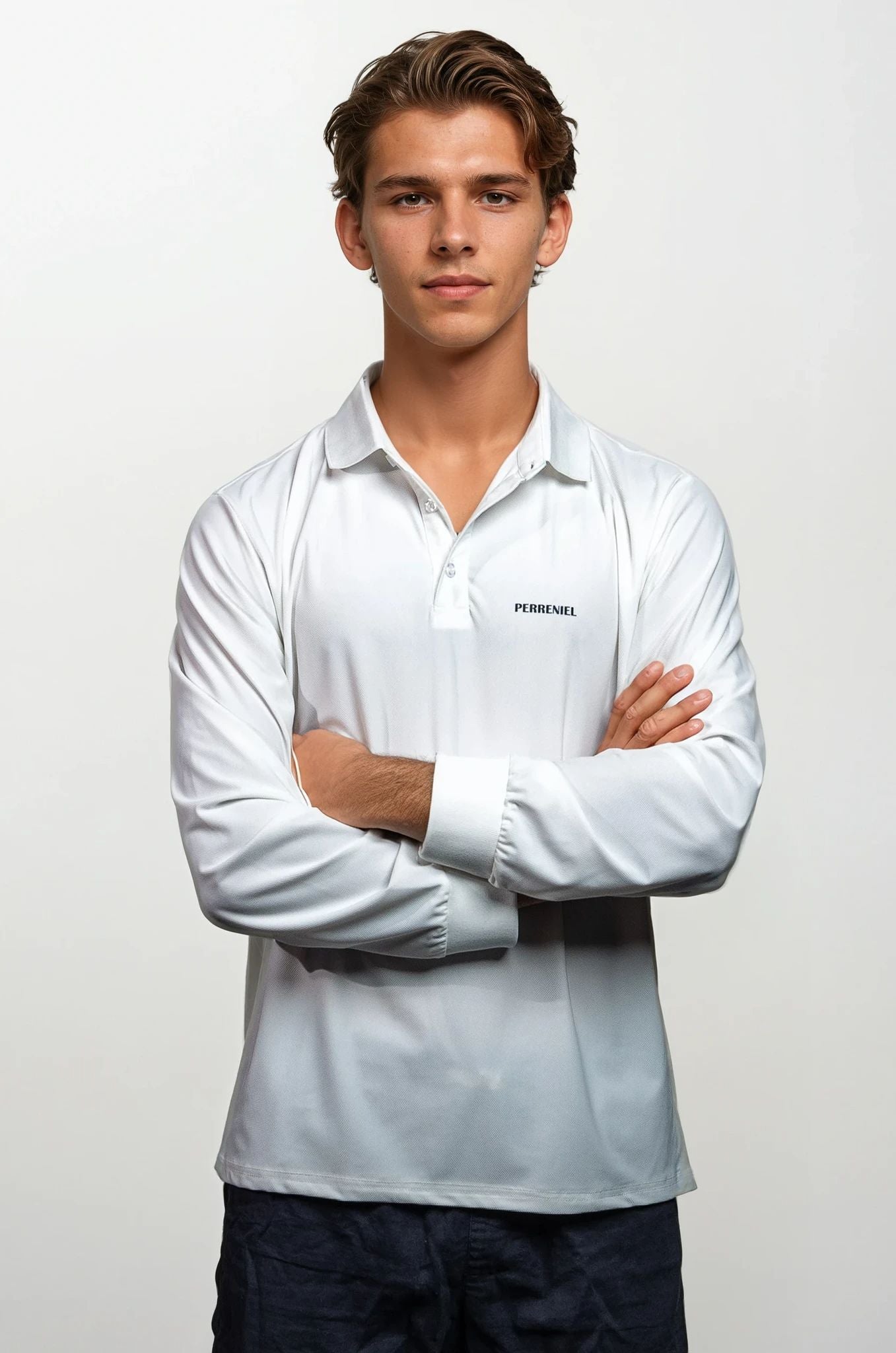 Man wearing a white shirt with Perreniel logo on a plain background